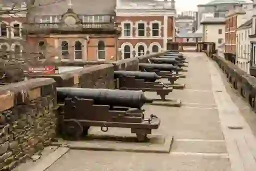 Historic cannons line the Derry City Walls, overlooking central Derry~Londonderry and reflecting its 17th-century fortifications.
