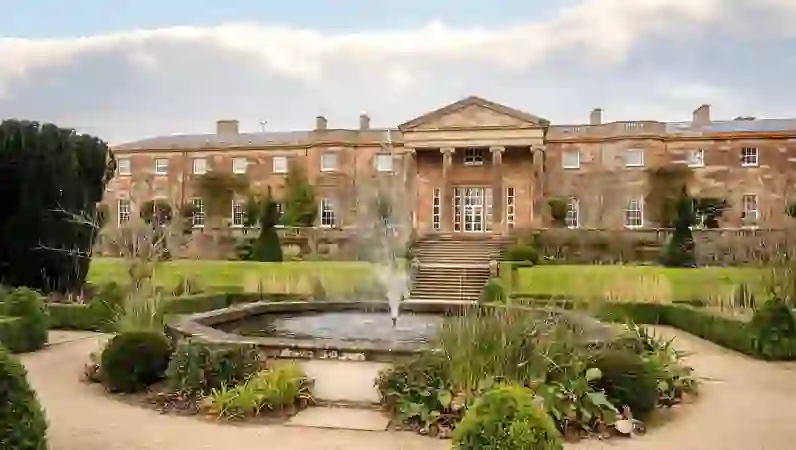 Hillsborough Castle with Georgian façade, formal gardens and central fountain in County Down.