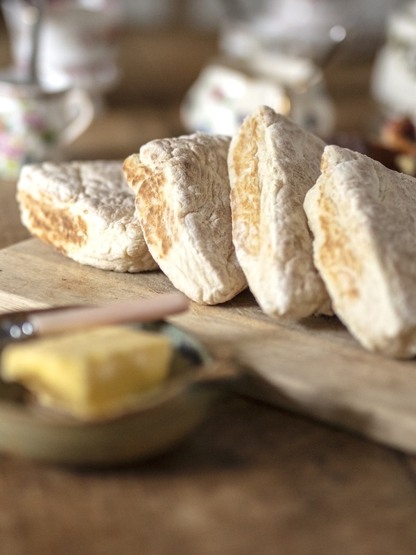 Freshly baked soda bread served on a rustic farmhouse table in Northern Ireland.