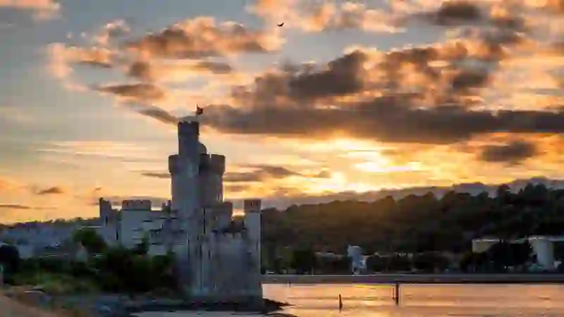 Blackrock Castle on the River Lee, Cork City, at sunset with dramatic sky and waterfront setting.