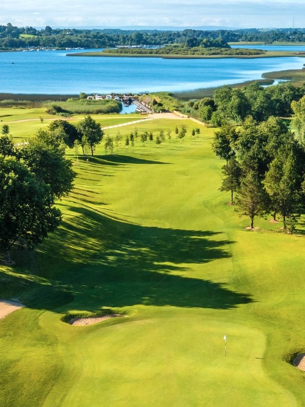 Aerial view of Glasson Lakehouse Golf Course, Westmeath, with green fairways beside the blue waters of Lough Ree.