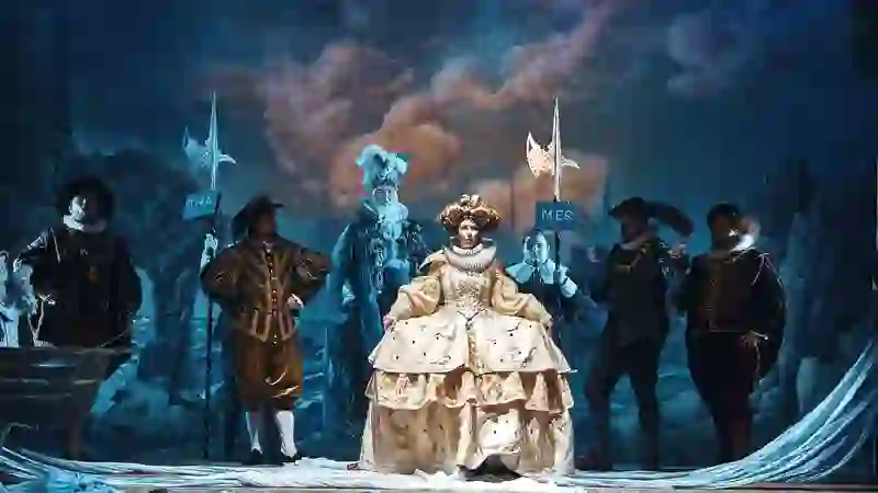 Opera performers in elaborate period costumes on stage during the Wexford Festival Opera.