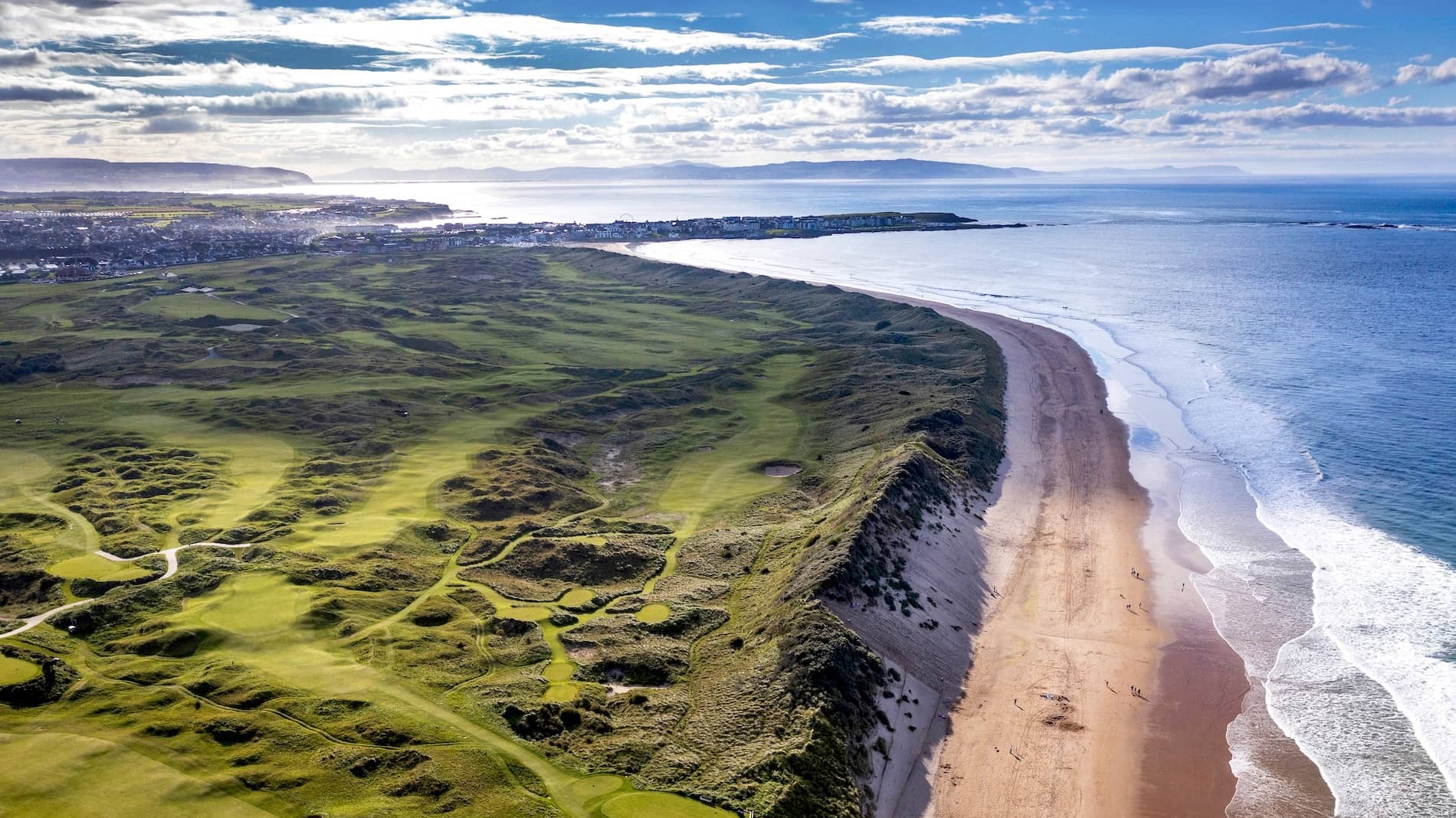 Aerial view of Royal Portrush Golf Club and Whiterocks Beach along the Causeway Coast in County Antrim, Northern Ireland.