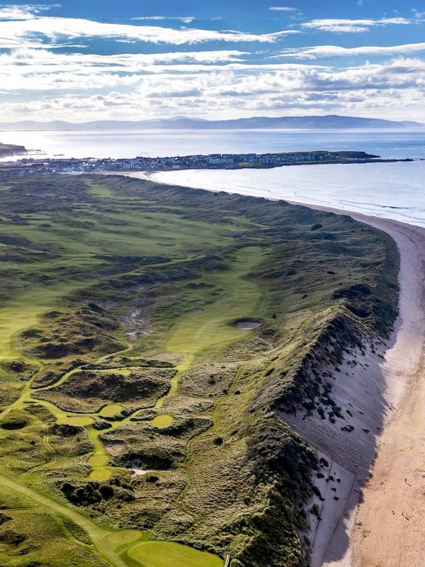 Aerial view of Royal Portrush Golf Club and Whiterocks Beach along the Causeway Coast in County Antrim, Northern Ireland.