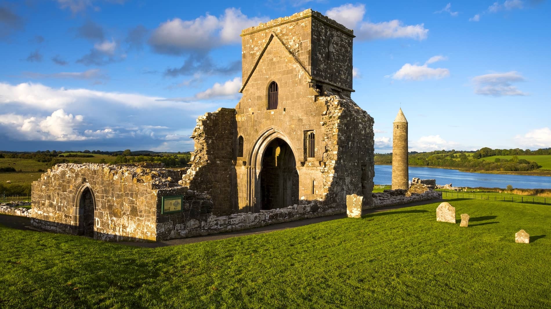 Medieval church ruins and round tower on Devenish Island overlooking Lough Erne in County Fermanagh, Northern Ireland.
