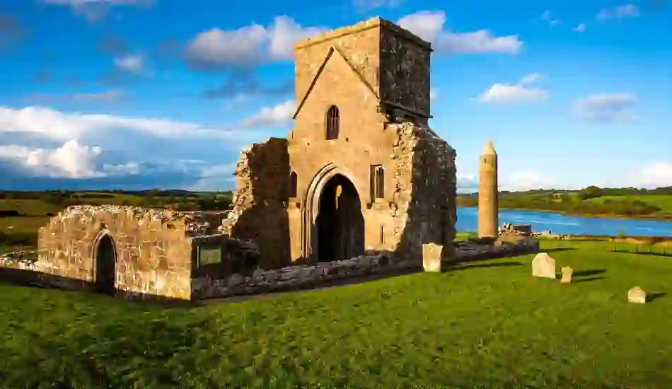 Medieval church ruins and round tower on Devenish Island overlooking Lough Erne in County Fermanagh, Northern Ireland.
