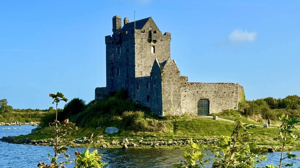 Medieval Dunguaire Castle standing beside the water near Kinvara in County Galway.