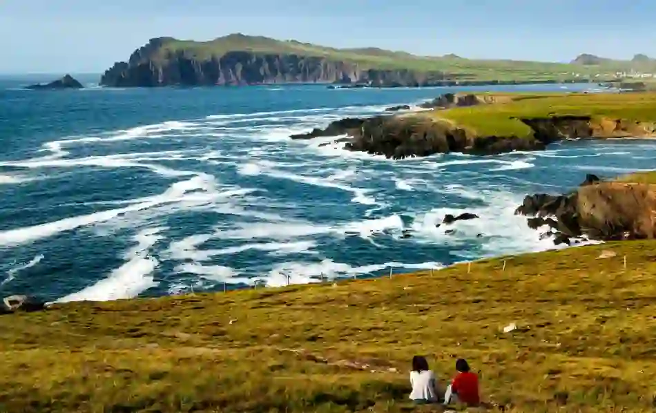 Clifftop view of waves crashing along rugged Dunmore Head in County Kerry.