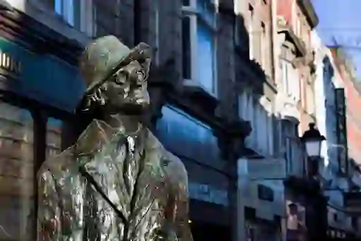 James Joyce statue on North Earl Street, Dublin, with shops in the background.