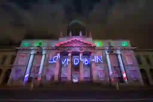 Custom House in Dublin lit up at night with ‘Love Dublin’ projection for New Year's Festival.