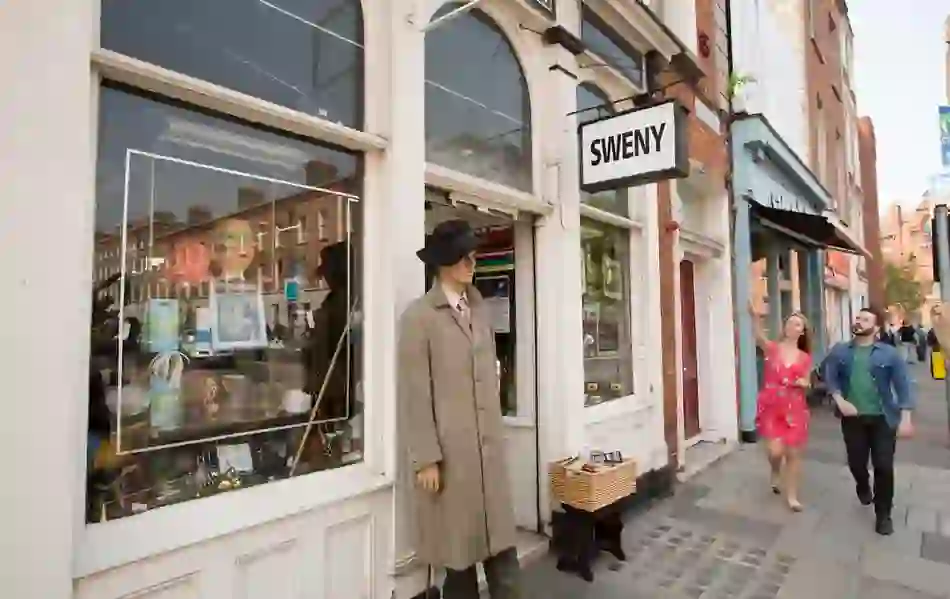 Exterior of Sweny’s Pharmacy in Dublin, famous from James Joyce’s Ulysses, with a mannequin at the door.