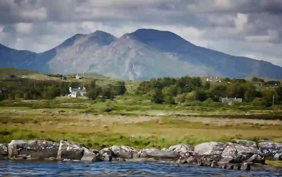 Rolling Connemara landscape with rugged peaks of the Twelve Bens mountains in County Galway.