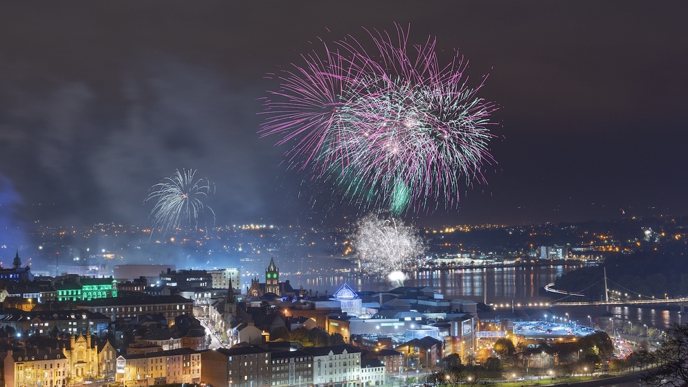 Colourful fireworks burst above Derry~Londonderry during Derry Halloween.