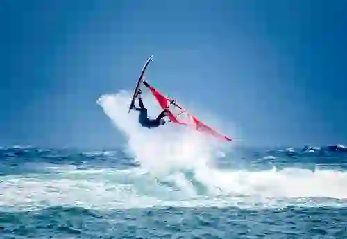 Windsurfer catching a wave off Fanore Beach on Ireland’s Wild Atlantic Way, County Clare.