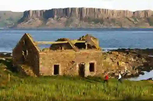 Ruined stone cottage by the coast at Ushet Point on Rathlin Island, County Antrim, Northern Ireland.