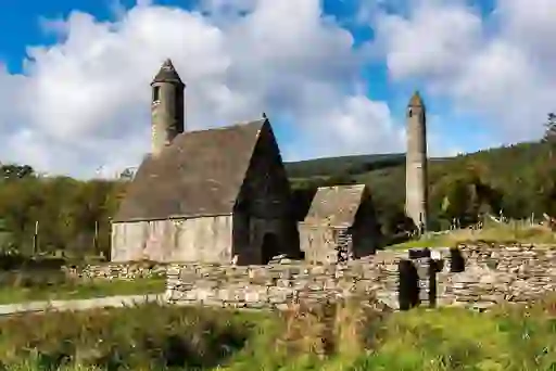 Ruins of Glendalough’s stone church and round tower in County Wicklow, Ireland.