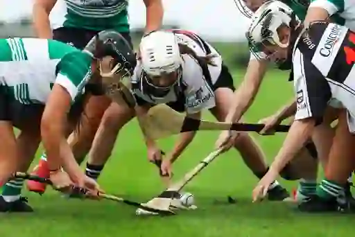 Group of camogie players from opposing teams battle for possession of the sliotar during a junior championship in Cork.