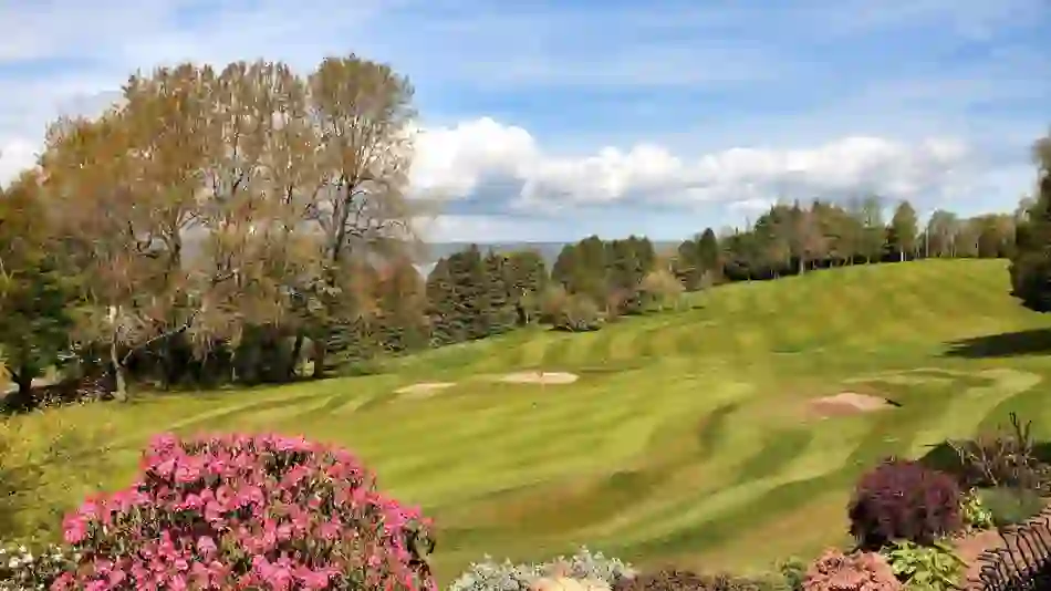 Holywood Golf Course, County Down, with floral landscaping and tree-lined fairways.