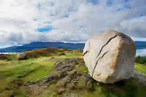 The Cloughmore Stone in County Down with carved script overlooking Carlingford Lough and Cooley Mountains.