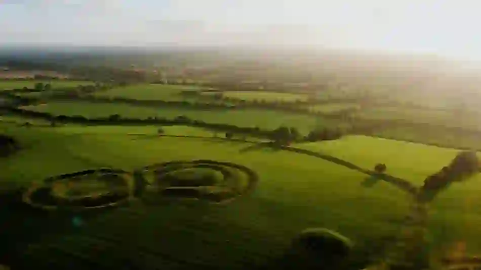 Early morning light over Rath of the Synods at the Hill of Tara, casting long shadows on the green fields of Meath.