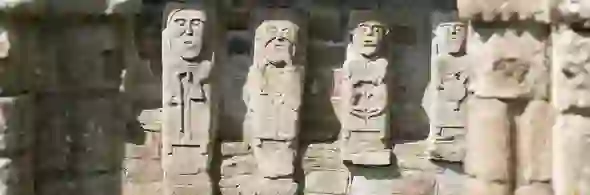 Close-up of carved stone figures on White Island, County Fermanagh, depicting early medieval religious imagery.