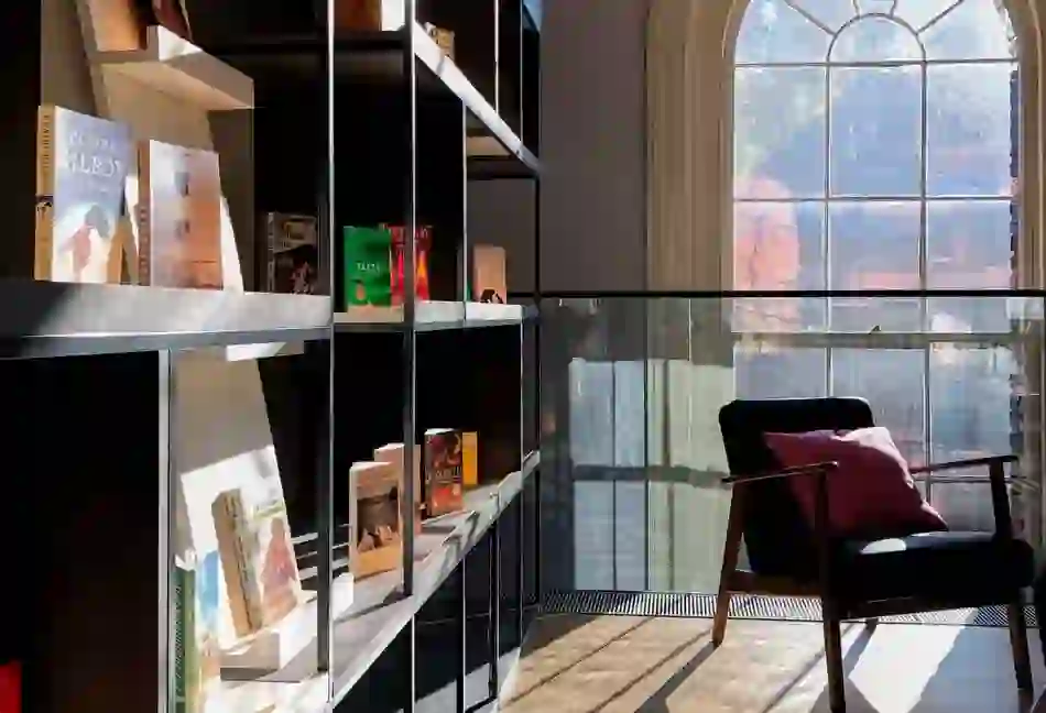 Sunlight through a window illuminates book displays and armchair in the Museum of Literature Ireland (MoLI), Dublin.