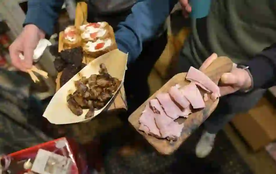 Platters of Limerick food including ham, black pudding, grilled meat, and bruschetta at the Milk Market.