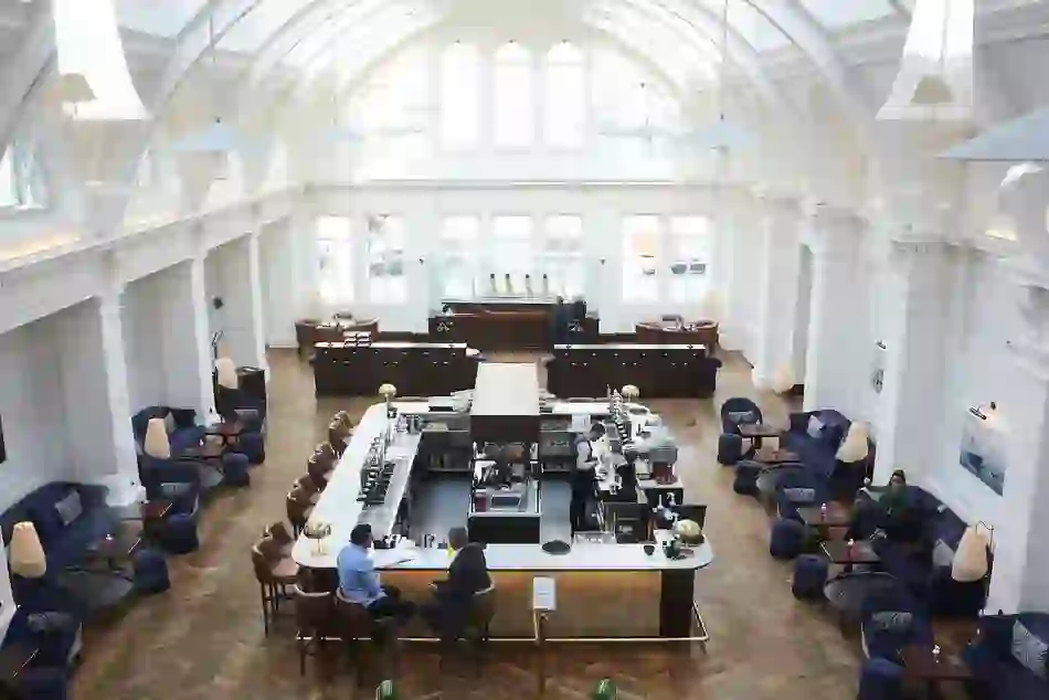 Bar at Titanic Hotel in Belfast’s former Harland and Wolff Drawing Offices with vaulted white ceilings.