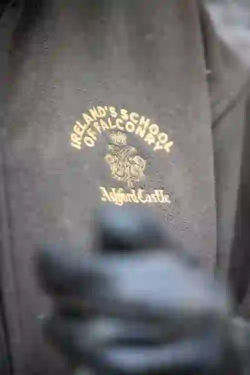 Close-up of a brown fleece embroidered with the Ireland’s School of Falconry logo at Ashford Castle.