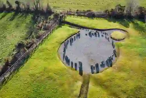 Aerial view of perfectly arranged Drumskinny Stone Circle, surrounded by grassy banks in Fermanagh.
