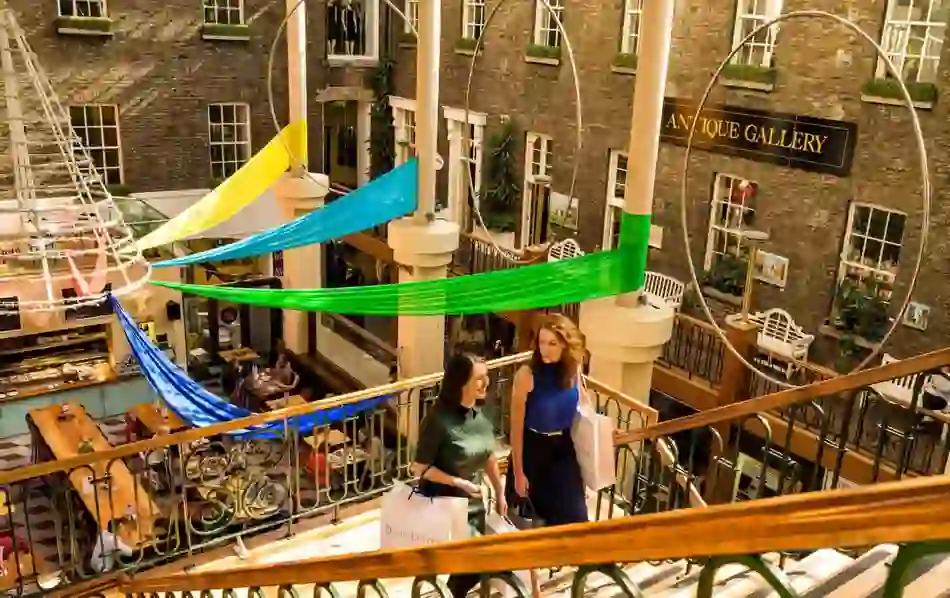 Two women shopping in the Powerscourt Centre, Dublin during Christmas season.