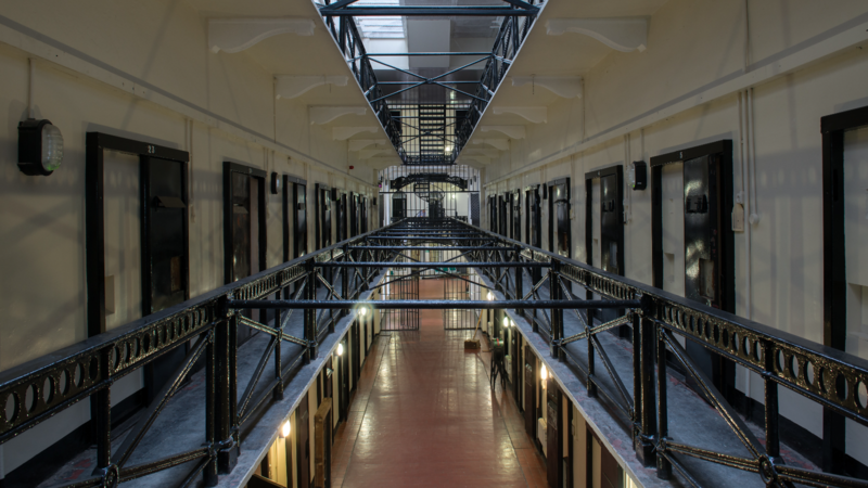 Victorian prison cell blocks and iron walkways inside Crumlin Road Gaol in Belfast.