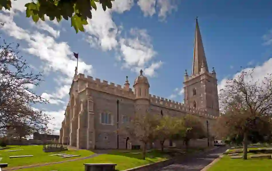 St Columb’s Cathedral in Derry~Londonderry with its tall spire and stone façade.