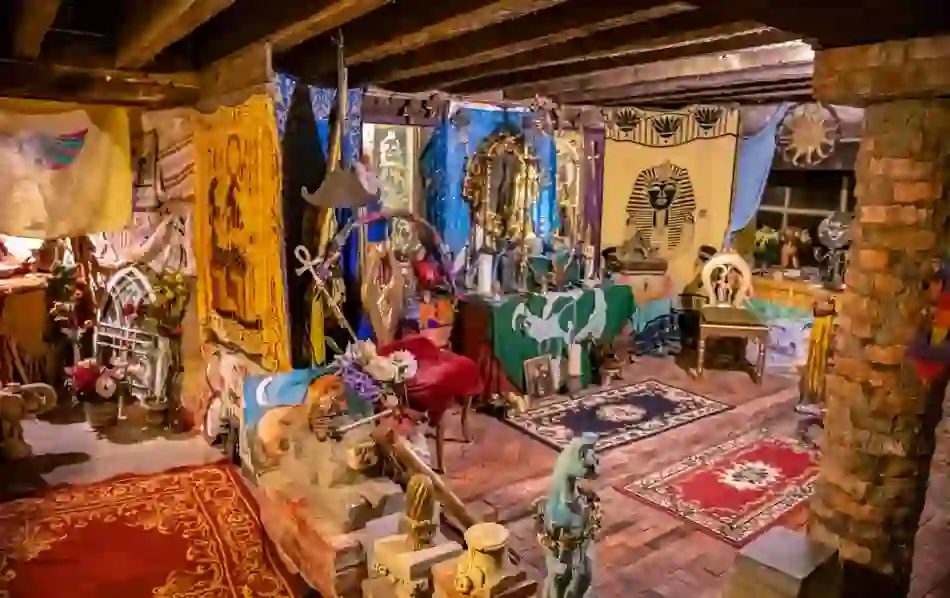 Eclectic altar with Egyptian motifs, flowers and textiles inside the Temple of Isis in County Carlow.