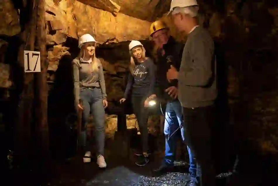 Guided tour at Arigna Mining Experience, County Roscommon, with visitors in hard hats learning about mining history.