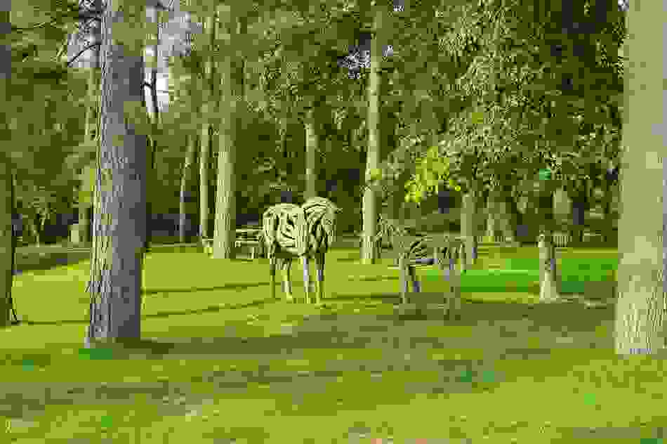 Wooden horse sculptures in parkland at the National Stud in County Kildare.