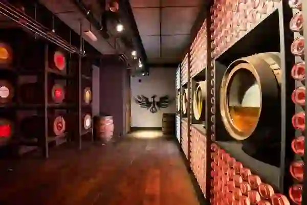 Display of whiskey barrels and bottles inside Teeling Whiskey Distillery in Dublin city.