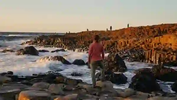 Person standing among the basalt columns of the Giant's Causeway, County Antrim.