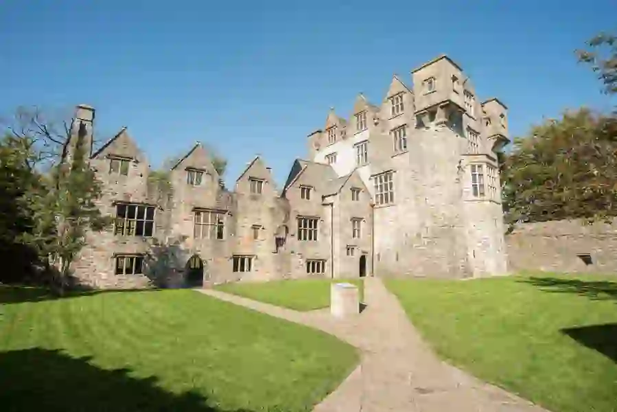 Historic Donegal Castle in the heart of Donegal town, surrounded by manicured lawns on a bright, clear day.