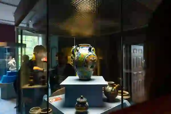 Visitors viewing historic ceramic vessels on display at the Hunt Museum in Limerick City.
