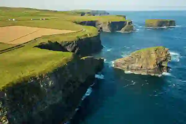 Waves crash against the Kilkee Cliffs on the Wild Atlantic Way in County Clare.