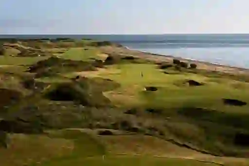 Coastal golf course at The European Club with rolling dunes and views of the Irish Sea.