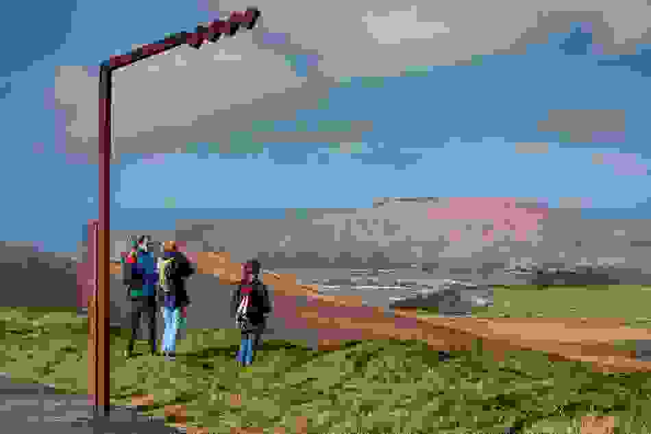 Walkers enjoying coastal views from Ceann Sleibhe on the Dingle Peninsula, County Kerry.