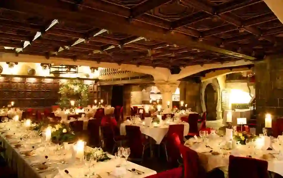 Candlelit medieval banquet hall at Belleek Castle, County Mayo.