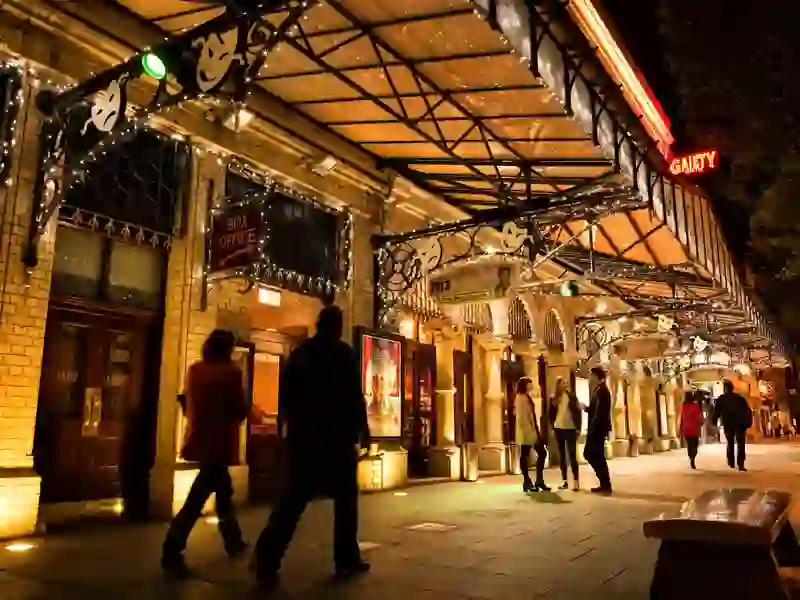 Evening view of the Gaiety Theatre in Dublin lit up with people outside.