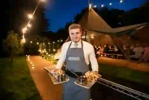 Waiter serving food at Armagh Food and Cider Festival, County Armagh.