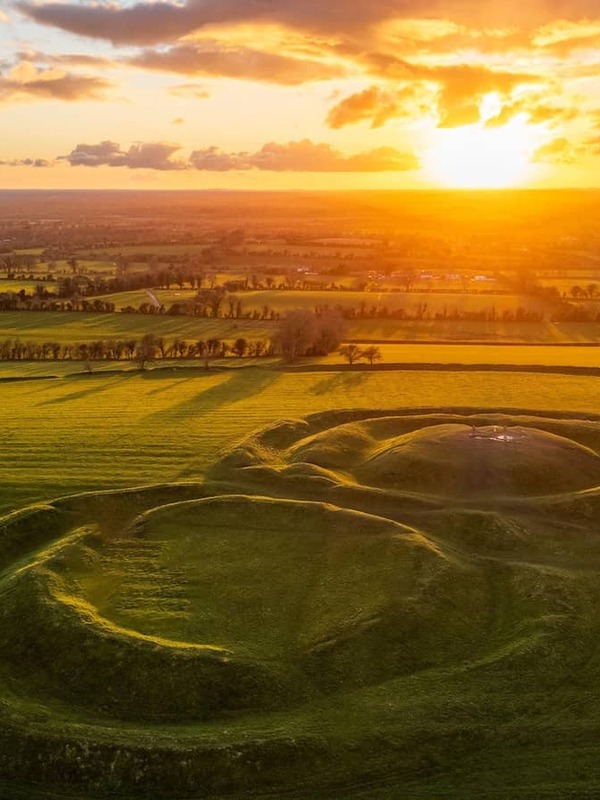 Sunrise over the ancient grassy earthworks at the Hill of Tara, County Meath.