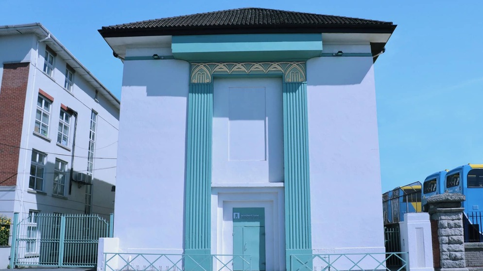 Exterior of Windmill Lane Recording Studios with teal accents and art deco design in Dublin, Ireland.