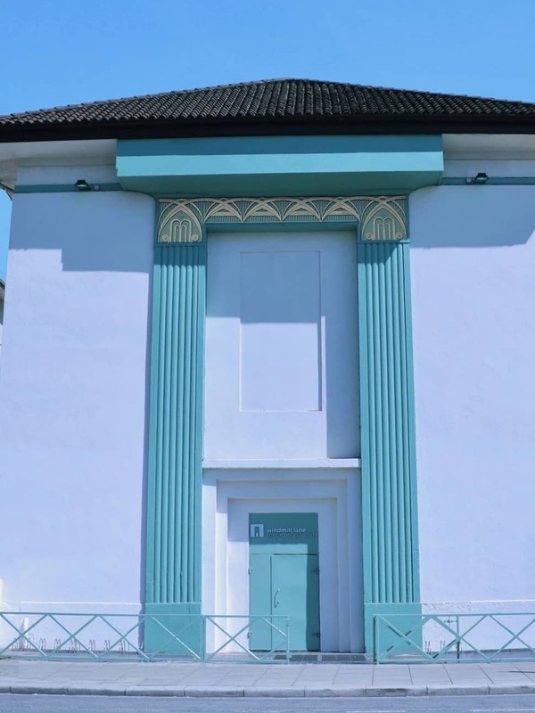 Exterior of Windmill Lane Recording Studios with teal accents and art deco design in Dublin, Ireland.