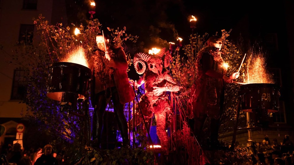 Fiery Halloween parade with drummers and a horned figure at Dublin’s Bram Stoker Festival.